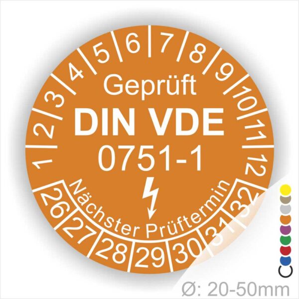Prüfplaketten rund, Farbe- Orange, Text "Geprüft gemäß DIN VDE 0751-1" in Weiß danach ein Elektro- Pfeil in Weiß, Startjahr- 26, Monatszahlen Oben und Jahreszahlen Unten in Kreisform. Über den Jahreszahlen Text "Nächster Prüftermin"