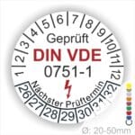 Prüfplaketten rund, Farbe- Weiß, Text "Geprüft gemäß DIN VDE 0751-1" in Schwarz danach ein Elektro- Pfeil in Rot, Startjahr- 26, Monatszahlen Oben und Jahreszahlen Unten in Kreisform. Über den Jahreszahlen Text "Nächster Prüftermin"