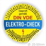 Prüfetiketten, Prüfplaketten rund, Farbe- Gelb in der Mitte ein Streifen in Blau, Text oberer Teil "Geprüft gemäß DIN-VDE" in Schwarz. Mittig Streifen in Rot mit dem Text " ELEKTRO-CHECK", danach Elektropfeil in Rot Startjahr- 27, Monatszahlen Oben und Jahreszahlen Unten in Kreisform. Über den Jahreszahlen Text "Nächster Prüftermin"