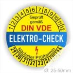Prüfetiketten, Prüfplaketten rund, Farbe- Gelb in der Mitte ein Streifen in Blau, Text oberer Teil "Geprüft gemäß DIN-VDE" in Schwarz. Mittig Streifen in Rot mit dem Text " ELEKTRO-CHECK", danach Elektropfeil in Rot Startjahr- 29, Monatszahlen Oben und Jahreszahlen Unten in Kreisform. Über den Jahreszahlen Text "Nächster Prüftermin"