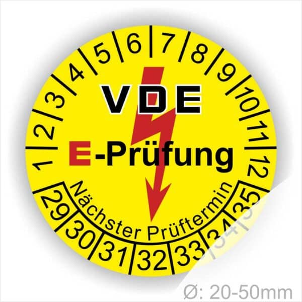 Prüfplaketten rund, Farbe- Gelb, Text "VDE E-Prüfung" in Schwarz in Hinergrund ein Elektro- Pfeil in Rot, Startjahr- 29, Monatszahlen Oben und Jahreszahlen Unten in Kreisform. Über den Jahreszahlen Text "Nächster Prüftermin"