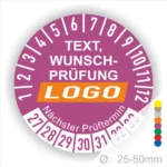 Rundes Prüfetikett mit dem Text "Wunschprüfung" und einem Platz für ein Logo, farblich gestaltet in Lila mit weißen Zahlen für die Monate und einem Hinweis auf den nächsten Prüftermin. Durchmesser von 25-50 mm.