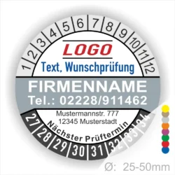 Graue Prüfplakette mit Monats- und Jahresring zur Kennzeichnung des nächsten Prüftermins. Individuell bedruckbar mit Firmenname, Telefonnummer, Logo und Wunschtext. Selbstklebender Prüfaufkleber für Wartung, Sicherheit und Betriebsmittelprüfung.