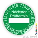 Prüfplakette, Prüfetikett rund, Farbe- Grün, Text "Nächster Prüftermin" in Weiß. Als nächstes kommt ein Beschriftungfeld / Leerfeld in Farbe Weiß. Startjahr- 24, Monatszahlen Oben und Jahreszahlen Unten in Kreisform.