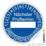 Prüfplakette, Prüfetikett rund, Farbe- Blau, Text "Nächster Prüftermin" in Weiß. Als nächstes kommt ein Beschriftungfeld / Leerfeld in Farbe Weiß. Startjahr- 26, Monatszahlen Oben und Jahreszahlen Unten in Kreisform.