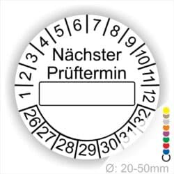 Prüfplakette, Prüfetikett rund, Farbe- Weiß, Text "Nächster Prüftermin" in Schwarz. Als nächstes kommt ein Beschriftungfeld / Leerfeld in Farbe Weiß im Schwarzen Rahmen. Startjahr- 26, Monatszahlen Oben und Jahreszahlen Unten in Kreisform.
