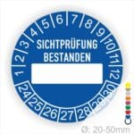 Prüfplakette, Prüfetikett rund, Farbe- Blau, Text "SICHTPRÜFUNG-BESTANDEN" in Weiß. Als nächstes kommt ein Beschriftungfeld / Leerfeld in Farbe Weiß. Startjahr- 24, Monatszahlen Oben und Jahreszahlen Unten in Kreisform.