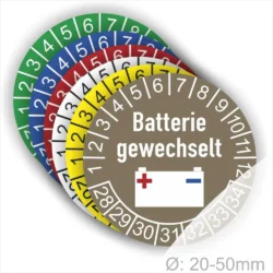 Farbenfrohe Batteriewechsel-Aufkleber mit der Aufschrift "Batterie gewechselt" und Nummerierung von 1 bis 12, geeignet für Durchmesser von 20-50 mm. Ideal zur Kennzeichnung von gewechselten Batterien.