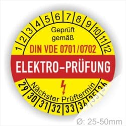 Prüfetiketten, Prüfplaketten rund, Farbe- Gelb in der Mitte ein Streifen in Rot, Text oberer Teil "Geprüft gemäß DIN VDE 0701/0702" in Schwarz. Mittig Streifen in Rot mit dem Text " ELEKTRO-PRÜFUNG", danach Elektropfeil in Rot Startjahr- 29, Monatszahlen Oben und Jahreszahlen Unten in Kreisform. Über den Jahreszahlen Text "Nächster Prüftermin"