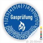 Prüfplaketten, Prüfetiketten rund, Farbe- Blau, Text "Gasprüfung" in Weiß danach eine Flamme als Pictogramm oder Icon in Weiß, Startjahr- 26, Monatszahlen Oben und Jahreszahlen Unten in Kreisform. Über den Jahreszahlen Text "Nächster Prüftermin"