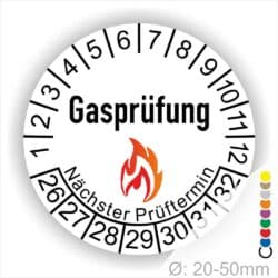 Prüfplaketten, Prüfetiketten rund, Farbe- Weiß, Text "Gasprüfung" in Schwarz danach eine Flamme als Pictogramm oder Icon in Rot, Startjahr- 26, Monatszahlen Oben und Jahreszahlen Unten in Kreisform. Über den Jahreszahlen Text "Nächster Prüftermin"