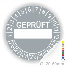 Prüfsiegel für Geräte mit einem Durchmesser von 20-50 mm, grau mit der Aufschrift "GEPRÜFT" und Platz für individuelle Eintragungen. Ideal für Sicherheits- und Qualitätsprüfungen.