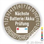 Prüfplaketten, Prüfetiketten rund, Farbe- Blau, Text "Nächste Batterie/Akku Prüfung" in Weiß. Icon Batterie, Startjahr- 25, Monatszahlen Oben und Jahreszahlen Unten in Kreisform.