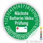 Prüfetiketten, Prüfplakette rund, Farbe- Grün, Text "Nächste Batterie/Akku Prüfung" in Weiß. Icon Batterie, Startjahr- 25, Monatszahlen Oben und Jahreszahlen Unten in Kreisform.