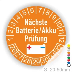 Runder Aufkleber zur Anzeige des Datums für die nächste Batterie- oder Akku-Prüfung, orange Hintergrund mit weißen Zahlen und einem Batteriesymbol. Durchmesser von 20-50mm.