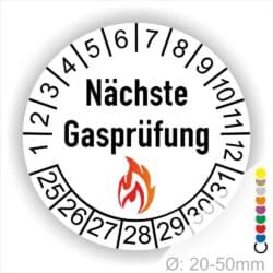 Prüfplaketten rund, Farbe- Weiß, Text "Nächste Gasprüfung" in Schwarz danach eine Flamme als Pictogramm oder Icon in Rot, Startjahr- 25, Monatszahlen Oben und Jahreszahlen Unten in Kreisform. Über den Jahreszahlen.