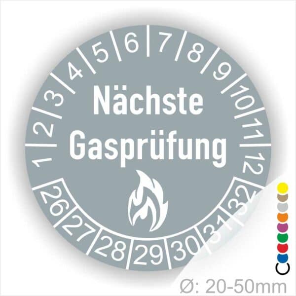 Prüfetiketten, Prüfplaketten rund, Farbe- Grau, Text "Nächste Gasprüfung" in Weiß danach eine Flamme als Pictogramm oder Icon in Weiß, Startjahr- 26, Monatszahlen Oben und Jahreszahlen Unten in Kreisform.