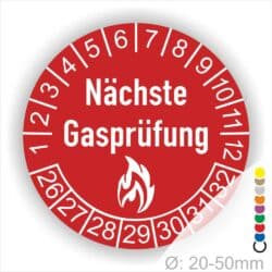 Prüfetiketten, Prüfplaketten rund, Farbe- Rot, Text "Nächste Gasprüfung" in Weiß danach eine Flamme als Pictogramm oder Icon in Weiß, Startjahr- 26, Monatszahlen Oben und Jahreszahlen Unten in Kreisform.