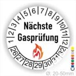 Prüfplaketten, Prüfetiketten rund, Farbe- Weiß, Text "Nächste Gasprüfung" in Schwarz danach eine Flamme als Pictogramm oder Icon in Rot, Startjahr- 26, Monatszahlen Oben und Jahreszahlen Unten in Kreisform. Über den Jahreszahlen.