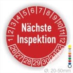 Prüfplaketten, Prüfetiketten rund, Farbe- Rot, Text "Nächste Inspektion" in Weiß. Startjahr- 26, Monatszahlen Oben und Jahreszahlen Unten in Kreisform.