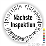 Runder Inspektionsaufkleber mit der Aufschrift "Nächste Inspektion" und nummerierten Monatsmarkierungen von 1 bis 12 sowie zusätzlichen Zahlen von 27 bis 33. Ideal für die Fahrzeugwartung und -überprüfung. Durchmesser von 20 bis 50 mm.