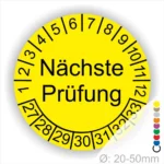 Wartungsplakette, Prüfetiketten rund, Farbe- gelb, Text "Nächste Prüfung" in schwarz. Startjahr- 27, Monatszahlen Oben und Jahreszahlen Unten in Kreisform.