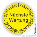 Prüfplaketten, Prüfetiketten rund, Farbe- Gelb, Text "Nächste Wartung" in Schwarz. Startjahr- 27, Monatszahlen Oben und Jahreszahlen Unten in Kreisform.