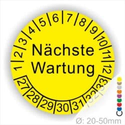 Prüfplaketten, Prüfetiketten rund, Farbe- Gelb, Text "Nächste Wartung" in Schwarz. Startjahr- 27, Monatszahlen Oben und Jahreszahlen Unten in Kreisform.