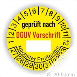Prüfplakette rund mit Text geprüft nach DGUV Vorschrift danach Beschriftungsfeld in Weiß und Text Nächster Prüftermin. Plaketten Farbe- Gelb und Text in schwarz ausser DGUV Vorschrift in Rot. Monatszahlen oben und Jahreszahlen unten beginnend mit Startjahr- 27, Durchmesser 20-50mm frei wählbar.