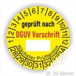 Prüfplakette rund mit Text geprüft nach DGUV Vorschrift danach Beschriftungsfeld in Weiß und Text Nächster Prüftermin. Plaketten Farbe- Gelb und Text in schwarz ausser DGUV Vorschrift in Rot. Monatszahlen oben und Jahreszahlen unten beginnend mit Startjahr- 28, Durchmesser 20-50mm frei wählbar.