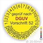 Prüfplakette rund mit Text geprüft nach Dguv Vorschrift 68 danach Nächster Prüftermin. Plaketten Farbe- Gelb und Text in Schwarz . Monatszahlen oben und Jahreszahlen unten beginnend mit Startjahr- 26