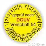 Gelbes Prüfetikett gemäß DGUV Vorschrift 54 mit Angaben zu Prüfnumer und nächsten Prüfterminen. Durchmesser 20-50 mm.