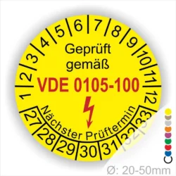 Runde gelbe Prüfplakette „Geprüft gemäß DIN VDE 0105-100“ mit Monatsring und Jahresring, Blitzsymbol und Aufdruck „Nächster Prüftermin“, Ø 20–50 mm