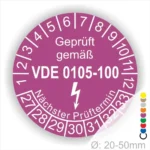 Prüfzertifikat gemäß VDE 0105-100, lila Prüfplakette mit nächstem Prüftermin und Zahlen von 1 bis 12 sowie 27 bis 33, für elektrische Geräte im Durchmesser von 20-50 mm.