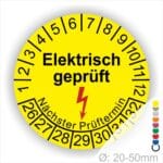 Prüfplaketten rund Farbe- Gelb, Text "Elektrisch geprüft" in Schwarz danach ein Elektro- Pfeil in Rot, Startjahr- 26, Monatszahlen Oben und Jahreszahlen Unten in Kreisform