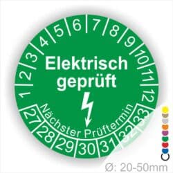 Prüfplaketten rund Farbe- Grün, Text "Elektrisch geprüft" in Weiß danach ein Elektro- Pfeil in Weiß, Startjahr- 27, Monatszahlen Oben und Jahreszahlen Unten in Kreisform