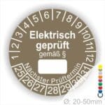 Pruefplakette mit Text Elektrisch geprüft gemäß Paragrapf als Zeichen und Beschriftungfeld zum eintragen des Paragraphs Farbe- Braun Startjahr- 25 mit Monatszahlen Oben und Jahreszahlen Unten Form ist Rund