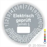 Alt-Text: Elektrischer Prüfaufkleber mit dem Hinweis "Elektrisch geprüft gemäß §", einer Skala von Prüfnummern und dem nächsten Prüftermin. Der Durchmesser des Aufklebers beträgt 20-50 mm.