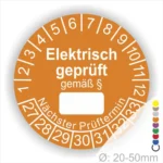 Runde Prüfplakette für elektrische Geräte, orange mit der Aufschrift "Elektrisch geprüft gemäß §". Enthält Platz für das Prüfdatenfeld und die nächsten Prüftermine. Durchmesser von 20-50 mm.