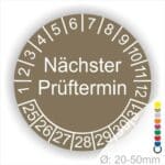 Mehrjahresplakette, Prüfplakette rund, Farbe- Braun, Text "Nächster Prüftermin" in Weiß. Startjahr- 25, Monatszahlen Oben und Jahreszahlen Unten in Kreisform.