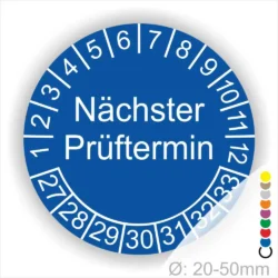 Prüfplakette mit Text Nächster Prüftermin Startjahr- 27, Monatszahlen Oben und Jahreszahlen Unten in Kreisform. Farbe Blau Prüfplakette mit Text Nächster Prüftermin Startjahr- 26, Monatszahlen Oben und Jahreszahlen Unten in Kreisform. Farbe Blau
