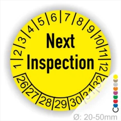 Gelbes Inspektionsetikett mit der Aufschrift "Next Inspection" und nummerierten Monaten, ideal für die Planung von Wartungen. Durchmesser von 20-50 mm.