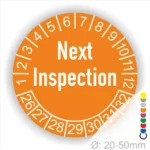 Prüfplaketten, Prüfaufkleber rund, Farbe- orange, Text auf Englisch "Next Inspection" in Weiss. Startjahr- 26, Monatszahlen Oben und Jahreszahlen Unten in Kreisform.