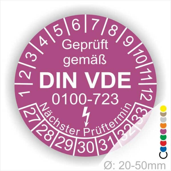 Prüfaufkleber rund, Farbe- Lila, Text "Geprüft gemäß VDE 0100-0723" in Weiß danach ein Elektro- Pfeil in Weiß, Startjahr- 27, Monatszahlen Oben und Jahreszahlen Unten in Kreisform. Über den Jahreszahlen Text "Nächster Prüftermin"