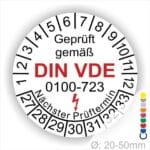 Prüfaufkleber rund, Farbe- Weiß, Text "Geprüft gemäß VDE 0100-723" in Schwarz danach ein Elektro- Pfeil in Rot, Startjahr- 27, Monatszahlen Oben und Jahreszahlen Unten in Kreisform. Über den Jahreszahlen Text "Nächster Prüftermin"