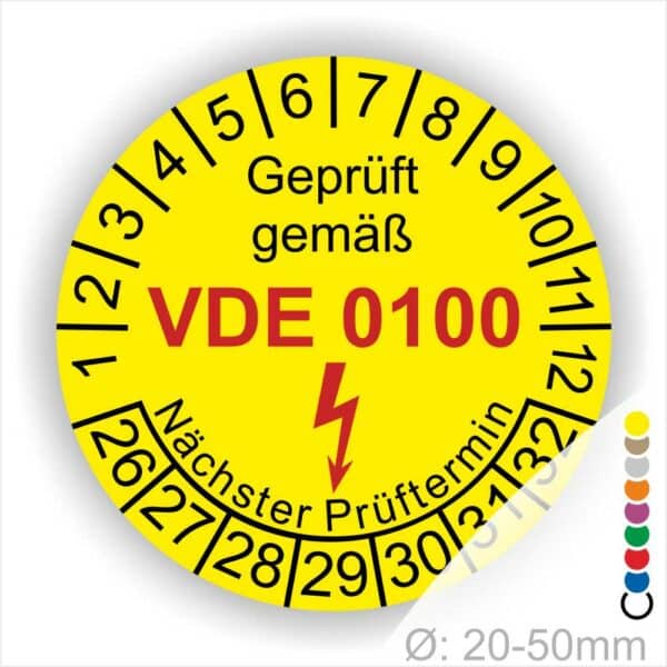 Prüfplaketten rund Farbe- Gelb, Text "Geprüft gemäß VDE 0100" in Schwarz danach ein Elektro- Pfeil in Rot, Startjahr- 26, Monatszahlen Oben und Jahreszahlen Unten in Kreisform. Über den Jahreszahlen Text "Nächster Prüftermin"