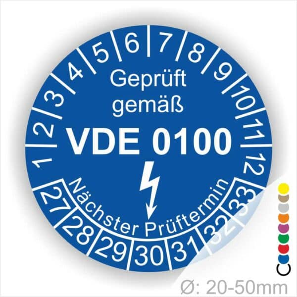 Prüfaukleber rund Farbe- Blau, Text "Geprüft gemäß VDE 0100" in Weiß danach ein Elektro- Pfeil in Weiß, Startjahr- 27, Monatszahlen Oben und Jahreszahlen Unten in Kreisform. Über den Jahreszahlen Text "Nächster Prüftermin"