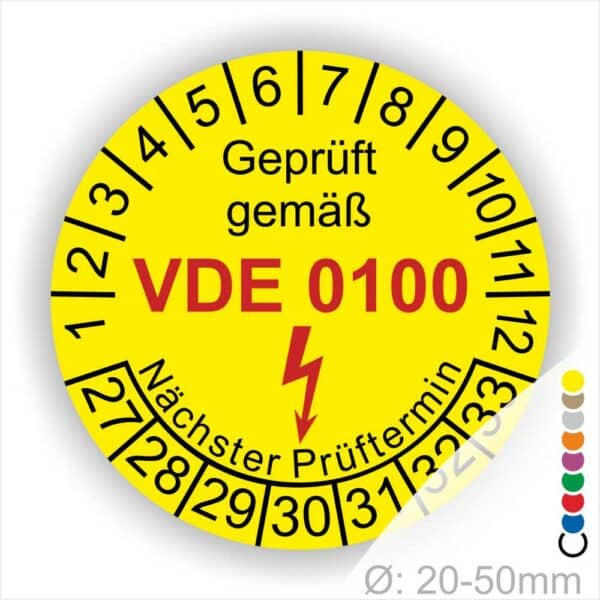 Prüfaufkleber rund, Farbe- Gelb, Text "Geprüft gemäß VDE 0100" in Schwarz danach ein Elektro- Pfeil in Rot, Startjahr- 27, Monatszahlen Oben und Jahreszahlen Unten in Kreisform. Über den Jahreszahlen Text "Nächster Prüftermin"