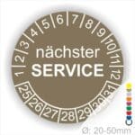 Prüfplaketten, Prüfetiketten rund, Farbe- Braun, Text "nächster SERVICE" in Weiß. Startjahr- 25, Monatszahlen Oben und Jahreszahlen Unten in Kreisform.