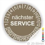 Prüfplaketten, Prüfetiketten rund, Farbe- Braun, Text "nächster SERVICE" in Weiß. Startjahr- 26, Monatszahlen Oben und Jahreszahlen Unten in Kreisform.